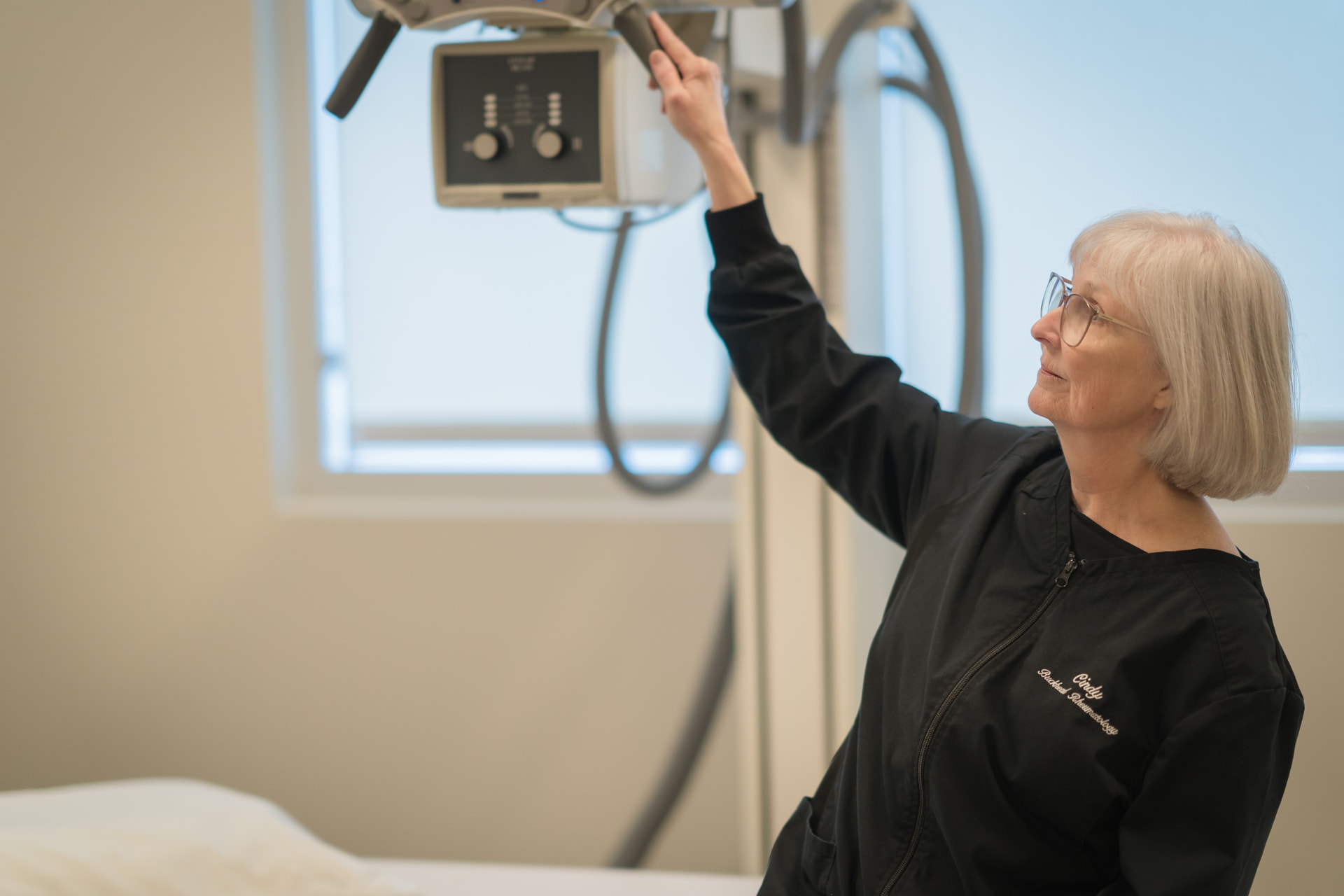 Cindy, X-ray technologist, preparing the on-site imaging equipment